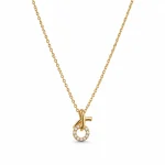 Cross and circle pendant with stones